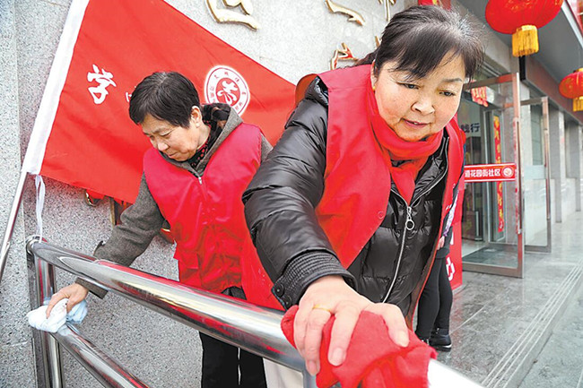 图①3月4日,焦作市解放区学生路社区学雷锋志愿者在新建成的学雷锋